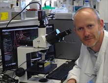 Dr Simon Powis with his NanoSight LM10 system to study exosome behaviour 